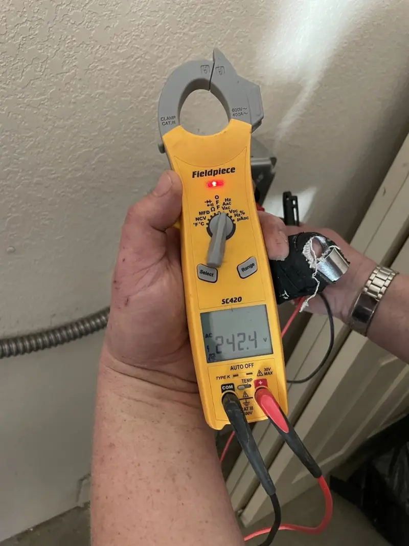Voltage testing with clamp meter during Whole House Surge Protector in Windsor